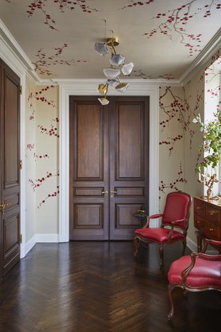 traditional entryway with wallpaper on ceiling and walls