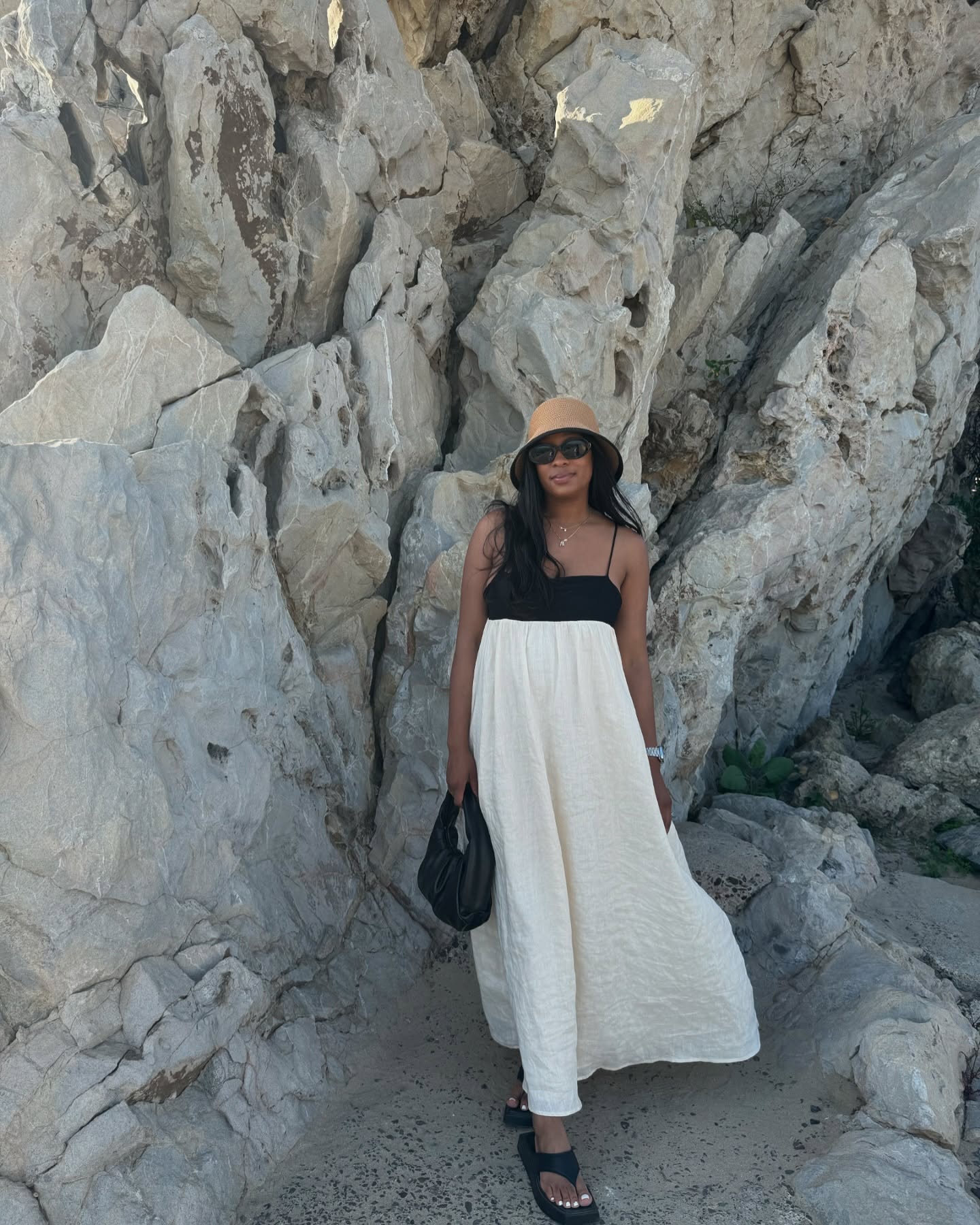 Simple Summer Outfits: @simplytandya wears a chic two-tone dress and straw sun hat