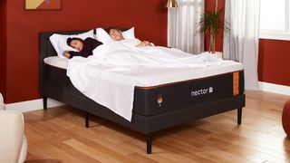 A couple asleep on the Nectar Premier Copper Mattress