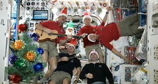 The space station's Expedition 34 astronaut crew sends Christmas greetings to Mission Control