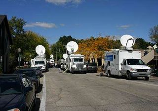 Satellite trucks blocks the small town road in Batavia, Illinois.
