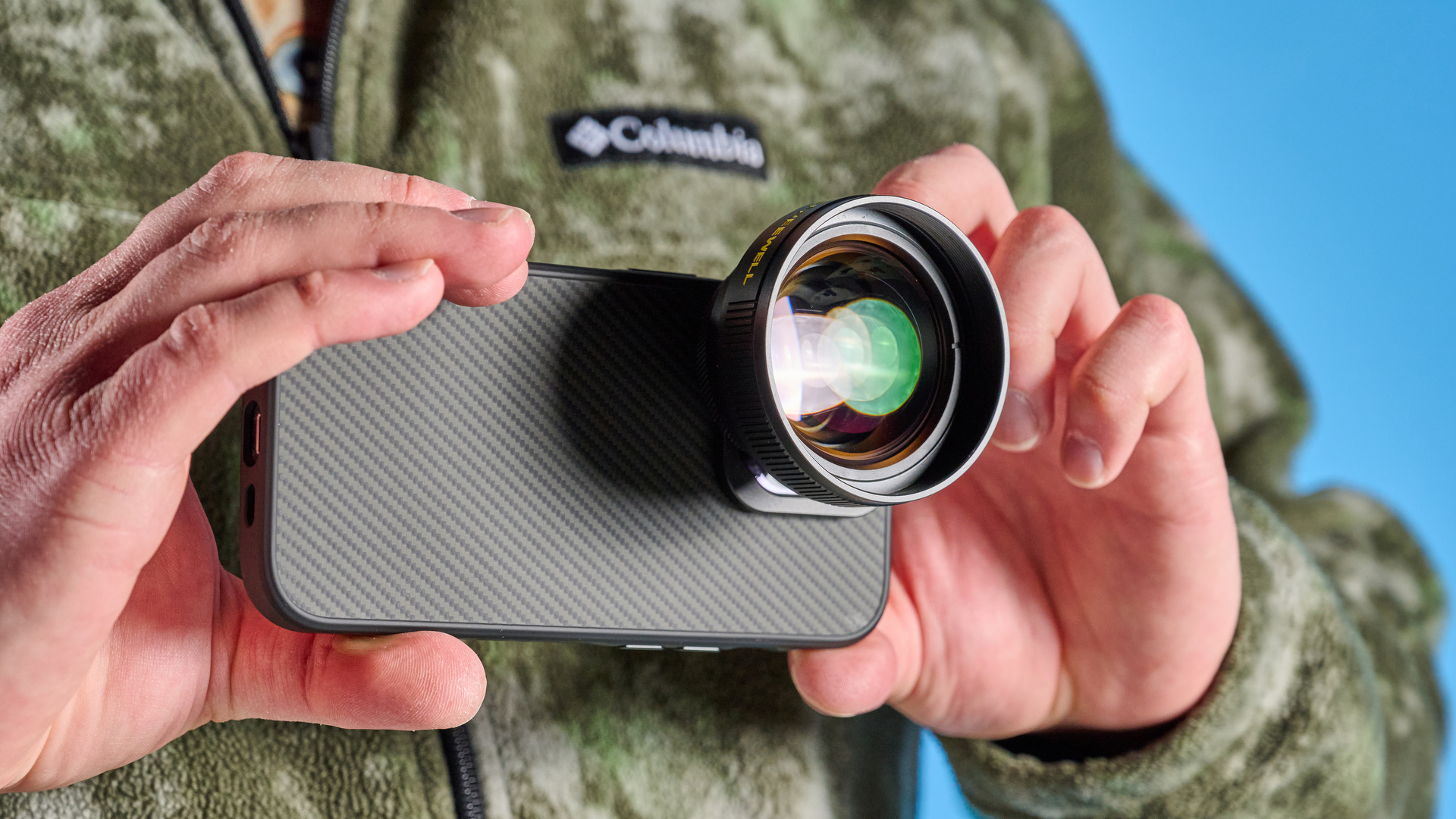 The Freewell iPhone lens 1.7x on a phone in hand