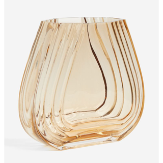 amber tinted glass vase with wide curved base and ridged design