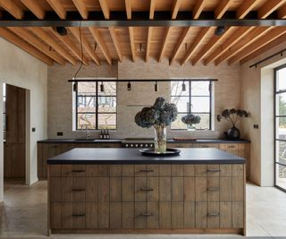 Black countertops and wooden cabinets