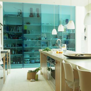 kitchen area with coloured glass sliding door