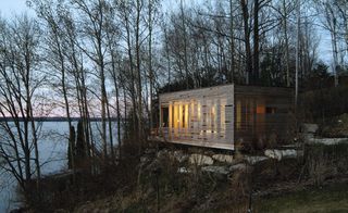 Exterior of Sunset cabin with lake in the background