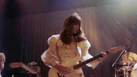 Punky Meadows playing guitar in Angel