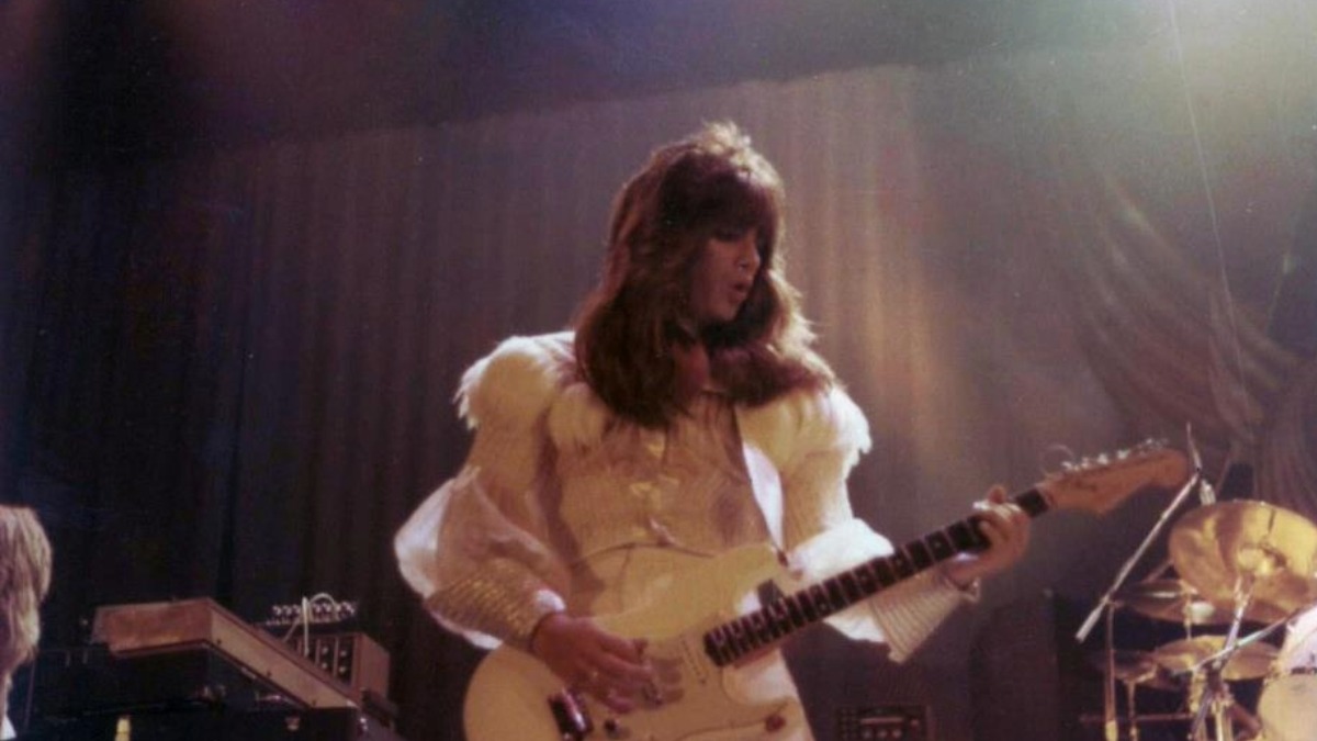 Punky Meadows playing guitar in Angel