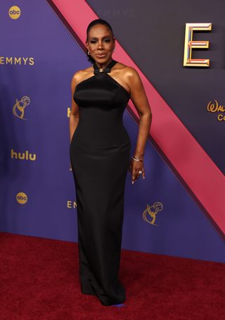 Sheryl Lee Ralph wears a black custom Versace dress.