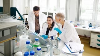a group of scientists carrying out research in a lab