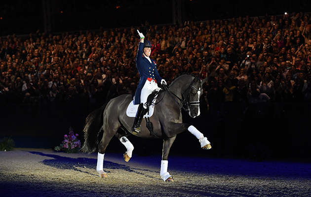 Charlotte waves goodbye as she exits the arena with a superb extended trot