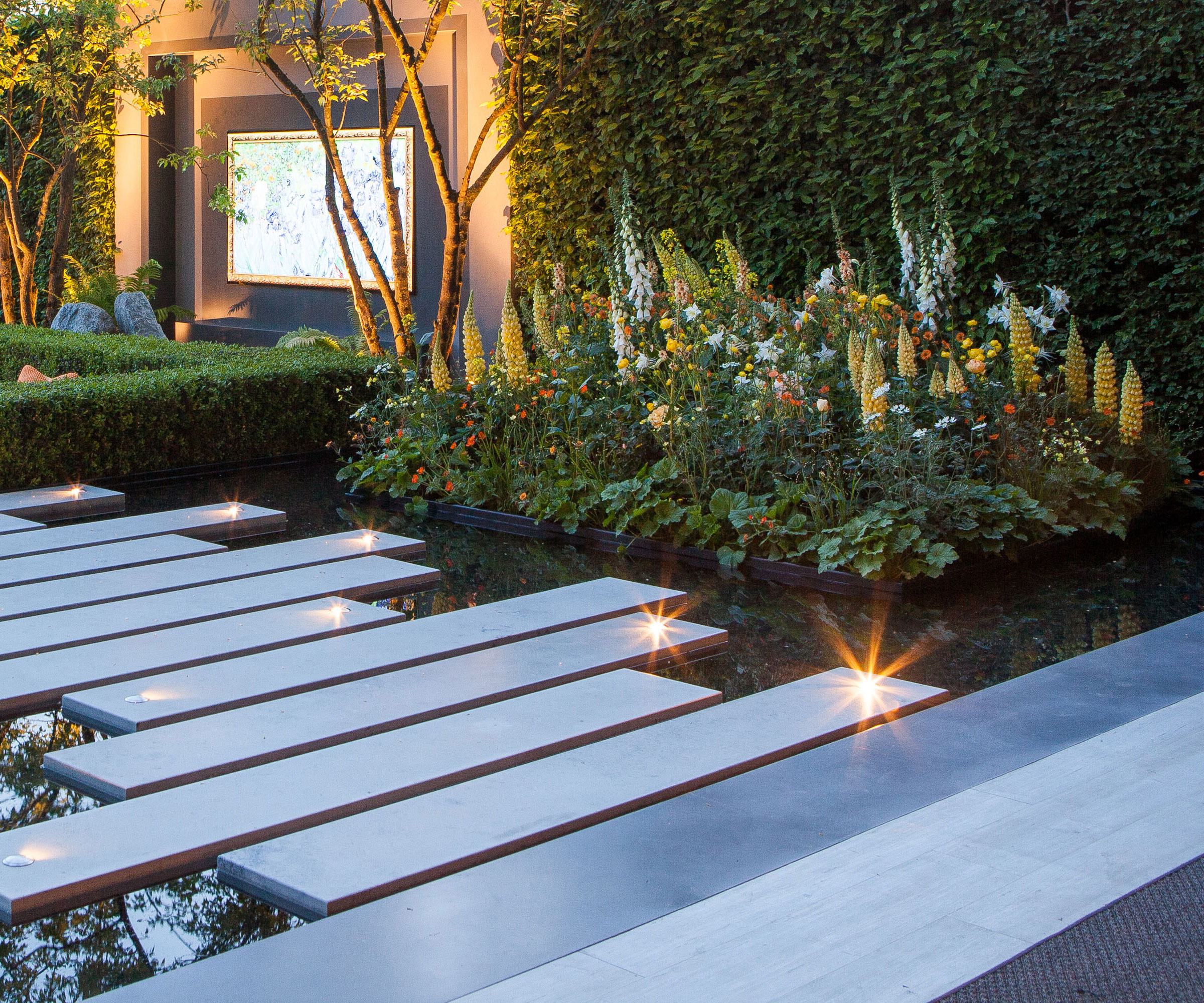 modern water feature garden pool with floor lighting