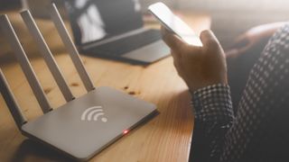 Man configuring wireless router