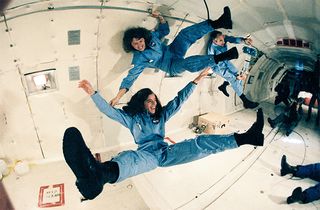 Teacher in space Christa McAuliffe (top), backup crew member Barbara Morgan (bottom) and payload specialist Greg Jarvis (back right) training in a KC-135 "vomit comet" in the 1980s.