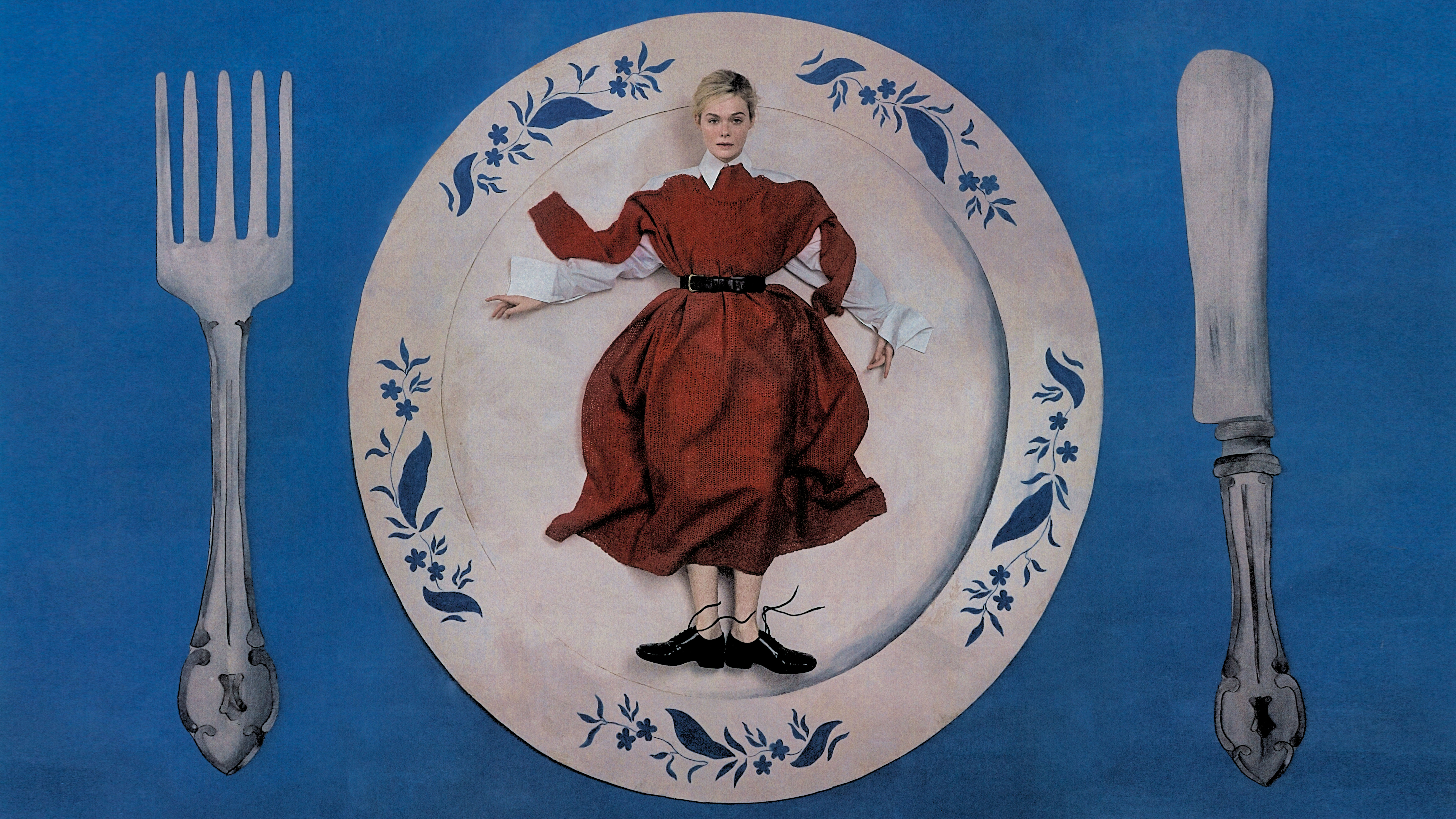 Hero image for Elle Fanning's January cover story withBest Knockoff Luxury Clothing
. Fanning is lying flat on a plate made of painted cardboard with a fork on her left and knife on her right. She is wearing a red belted dress with white button-down shirt underneath and black lace-up shoes. 