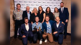 A group of people accept an award at Wildscreen Festival