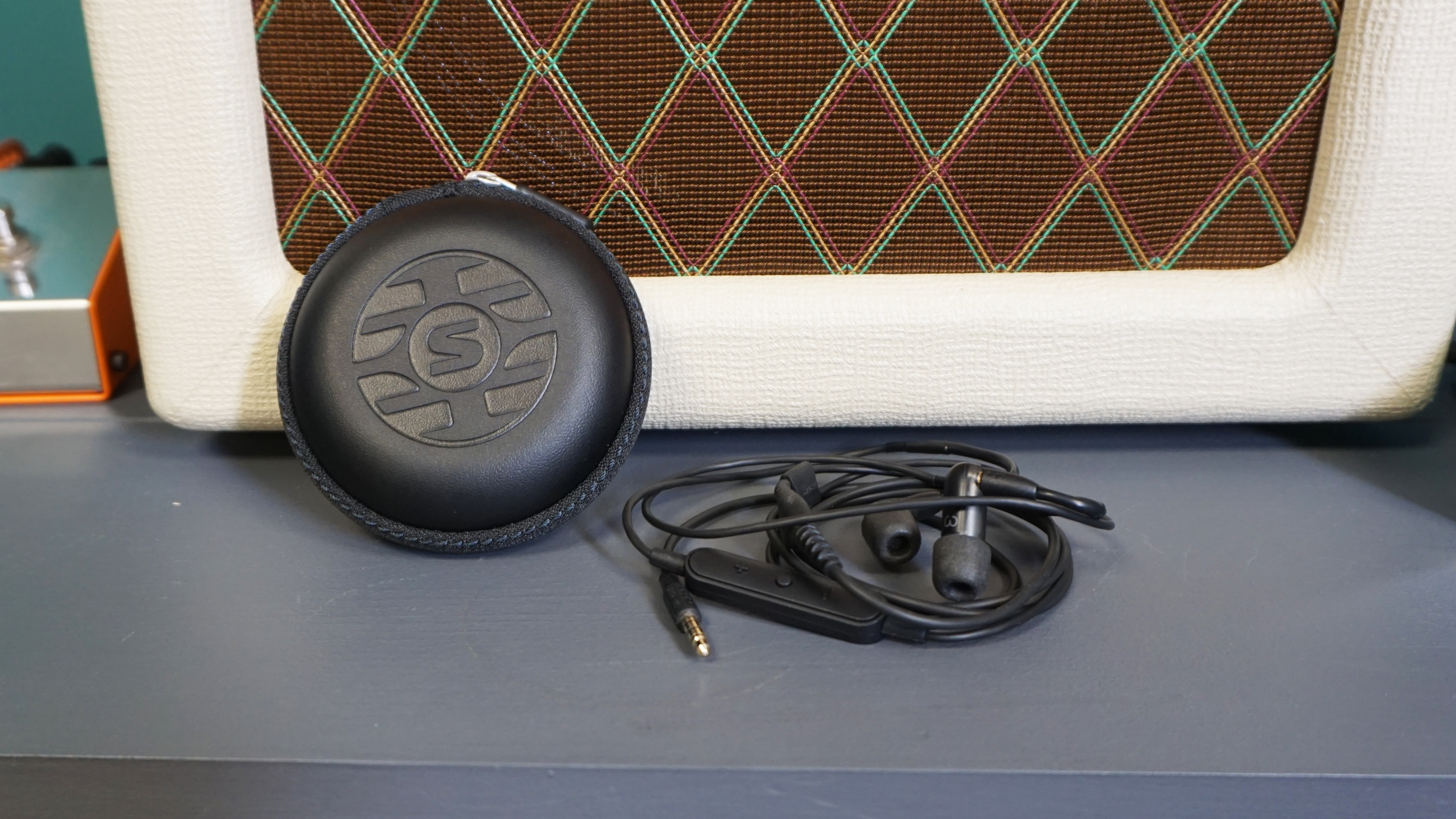 Shure AONIC 3 next to carry case