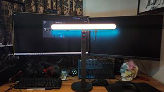 The Logitech Litra Beam LX key light set-up on a desk.