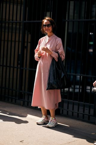 woman wearing shirtdress and sneakers