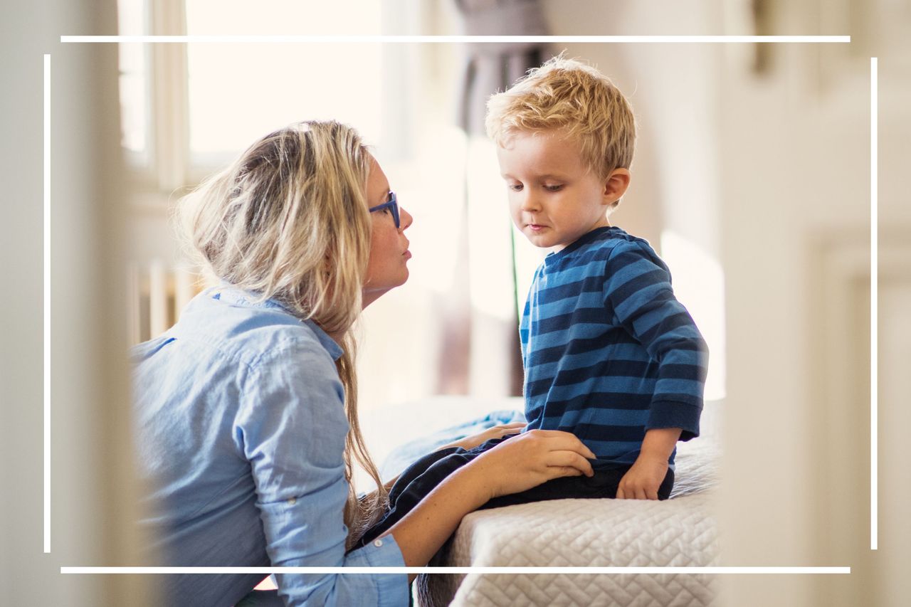 When family disagree with your parenting style illustrated by a woman sat with child on bed