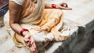 When did yoga originate? Woman meditating