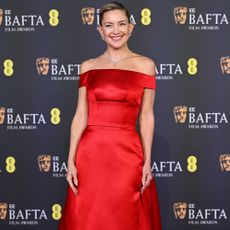 Sadie Sink wears a sage green satin dress at the BAFTAs 2026.