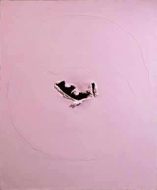 Concetto spaziale, 1962, a pink/beige painting with a tare in the centre.