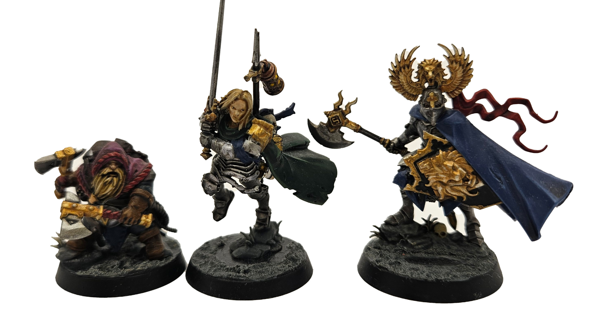 A trio of Warhammer Quest: Darkwater hero models against a plain background