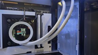 The NZXT Kraken Plus 360 RGB liquid cooler installed in a test bench.