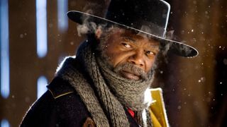 Samuel L. Jackson sits bundled up in winter coats in Quentin Tarantino's The Hateful Eight