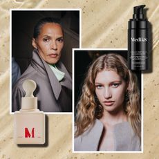 a tan watery background with an older black woman and a young white woman both in gray suits with a tan bottle with red writing and a black bottle with white writing