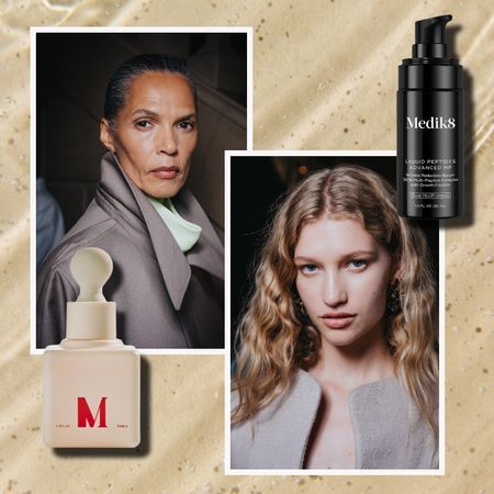 a tan watery background with an older black woman and a young white woman both in gray suits with a tan bottle with red writing and a black bottle with white writing