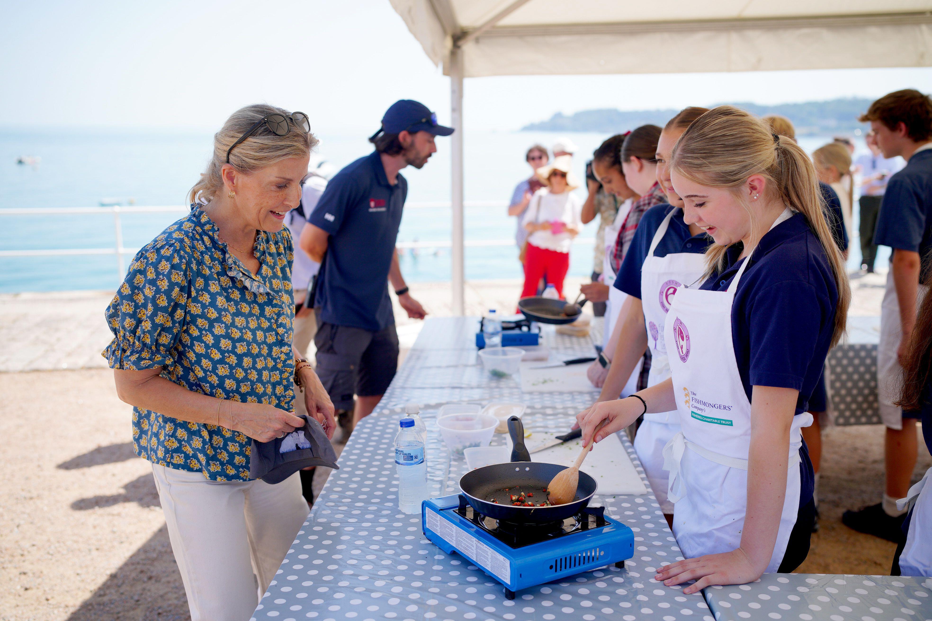 Duchess Sophie talking to people at a food tent