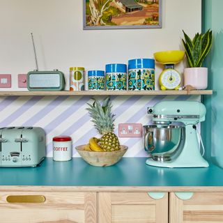 A colourful kitchen with pastel kitchen appliances
