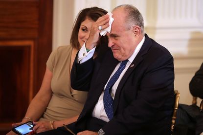 Rudy Giuliani mops his brow
