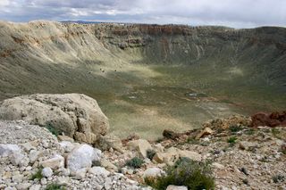 This meteor crater in Arizona was created 50,000 years ago when an iron meteorite struck the Earth. It is about one mile across.