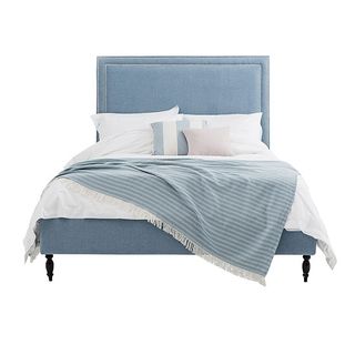 Blue Charlotte chrome-studded bed with white and blue bedlinen
