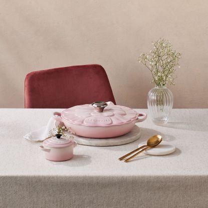 Le Creuset Cast Iron Petal Shallow Casserole on table