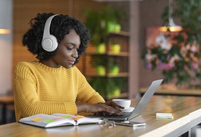 A woman on a laptop.