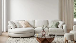 A white rounded chaise sofa in an all white living room