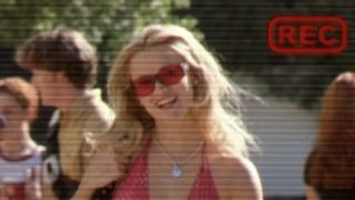 A screenshot of Elle smiling in her admissions video in Legally Blonde