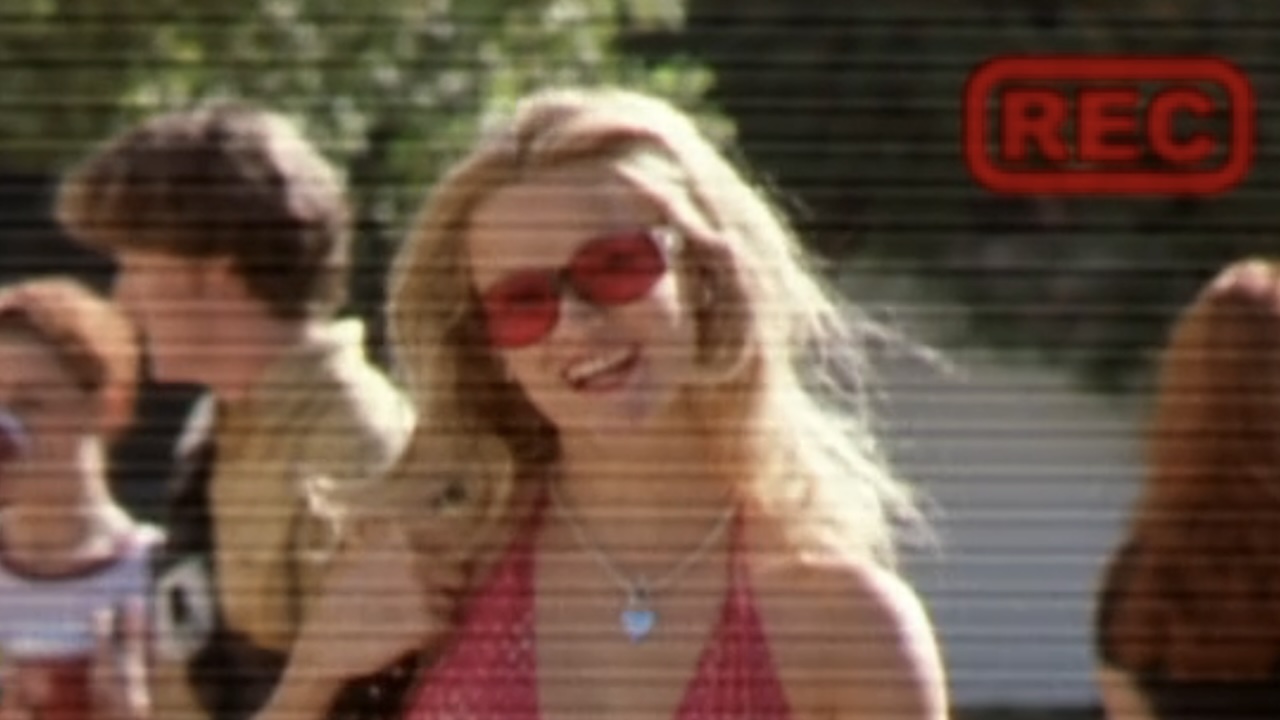 A screenshot of Elle smiling in her admissions video in Legally Blonde