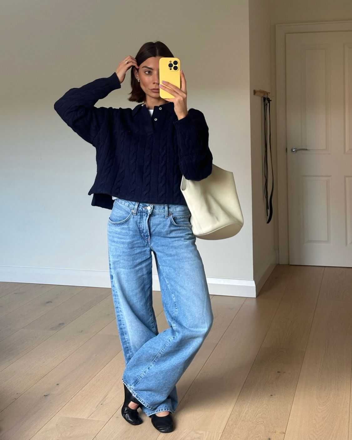 Polo shirt, low-rise jeans, and ballet flats outfit