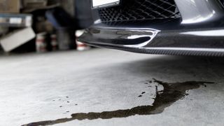 car leaking oil on driveway