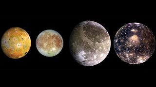Composite images from left to right are Ganymede, a large gray moon with bright white streaks on the surface. Callisto, a dark gray moon with bright specks across the surface. Io, is an orange/yellow moon covered in volcanoes. Europa, is a light gray moon with a distinct rusty red coloration across a large portion of the surface. 