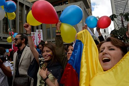 Excited Colombians celebrate the ceasefire between the government and FARC rebels.