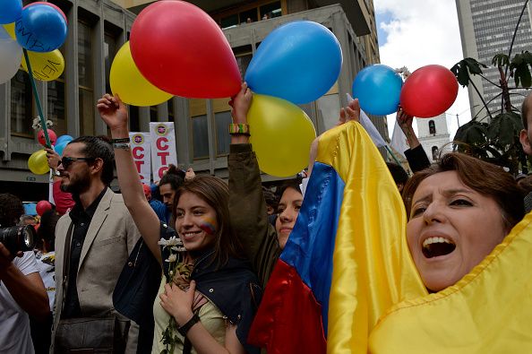 Excited Colombians celebrate the ceasefire between the government and FARC rebels.