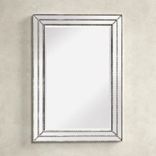 Beveled wall mirror.
