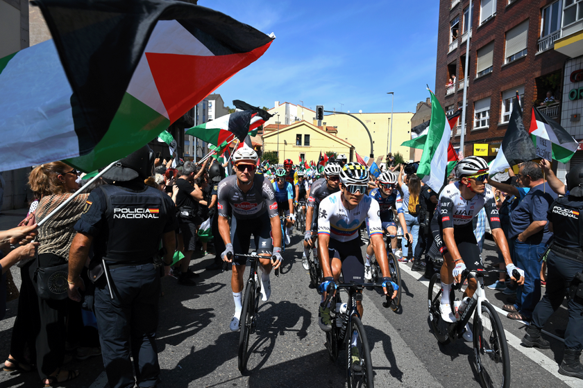 AVILES, SPAIN - SEPTEMBER 06: Pro-Palestinian protesters and the peloton prior prior to the La Vuelta - 80th Tour of Spain 2025, Stage 14 a 135.9km stage from Aviles to La Farrapona. Lagos de Somiedo 1711m / #UCIWT / on September 06, 2025 in Aviles, Spain. (Photo by Tim de Waele/Getty Images)