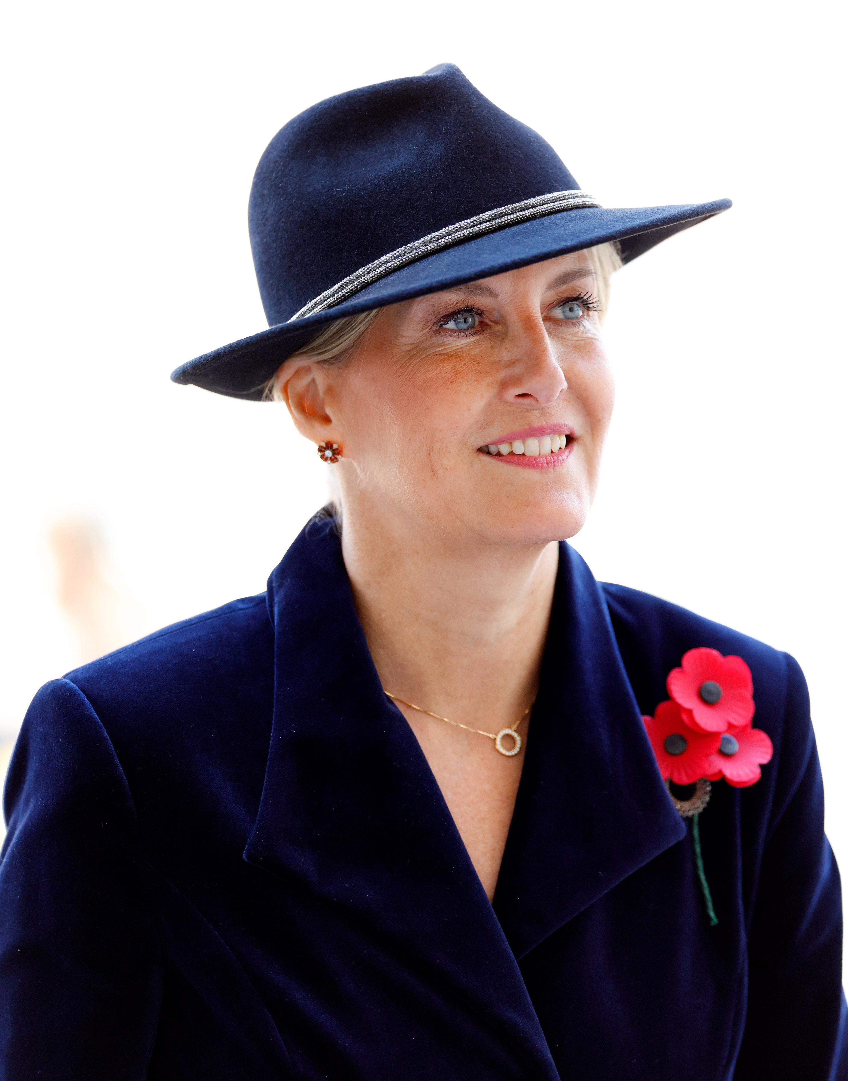 Duchess Sophie wearing a blue hat and red poppy pin